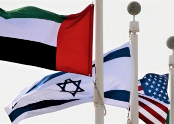 Emirati, Israeli and American and flags fly upon the arrival of Israeli and U.S. delegates at Abu Dhabi International Airport, in Abu Dhabi, United Arab Emirates August 31, 2020. REUTERS/Christopher Pike