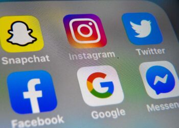 (FILES) In this file photo taken on October 01, 2019 a picture taken in Lille shows the logo of mobile app Instagram, Snapchat, Twitter, Facebook, Google and Messenger  displayed on a tablet. - The biggest reputational risk Facebook and other social media companies had expected in 2020 was fake news surrounding the US presidential election. Be it foreign or domestic in origin, the misinformation threat seemed familiar, perhaps even manageable. The novel coronavirus, however, has opened up an entirely different problem: the life-endangering consequences of supposed cures, misleading claims, snake-oil sales pitches and conspiracy theories about the outbreak. (Photo by DENIS CHARLET / AFP)