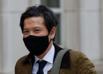Ex-Goldman Sachs banker Roger Ng arrives for his criminal trial, at the United States Courthouse in Brooklyn, New York, U.S. February 22, 2022. REUTERS/Eduardo Munoz
