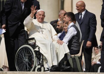 FILE-- Pope Francis waves as he leaves after his weekly general audience in St. Peter's Square at The Vatican, Aug. 28, 2024. (AP Photo/Andrew Medichini, File)