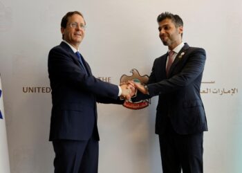 UAE Ambassador to Israel, Mohamed Al Khaja, and Israeli President Isaac Herzog shake hands during the opening ceremony of the Emirati embassy in Tel Aviv, Israel July 14, 2021. REUTERS/Amir Cohen/File Photo