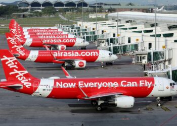FILE PHOTO: Airasia planes are seen parked at Kuala Lumpur International Airport 2, amid the coronavirus disease (COVID-19) outbreak in Sepang, Malaysia October 6, 2020. REUTERS/Lim Huey Teng
