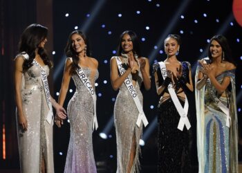 The final five contestants are announced during the final round of the 71st Miss Universe Beauty Pageant in New Orleans, Saturday, Jan. 14, 2023. Left to right are Miss Dominican Republic Andreina Martinez, Miss Curacao Gabriela Dos Santos, Miss Puerto Rico Ashley Carino, Miss USA R'Bonney Gabriel and Miss Venezuela Amanda Dudamel. (AP Photo/Gerald Herbert)