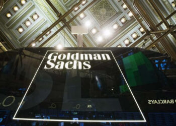 A Goldman Sachs sign is seen above the floor of the New York Stock Exchange shortly after the opening bell in the Manhattan borough of New York January 24, 2014.  REUTERS/Lucas Jackson