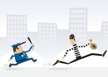 A policeman chasing a bank robber.