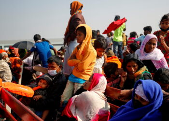 FILE PHOTO: Rohingya refugees sit on wooden benches of a navy vessel on their way to the Bhasan Char island in Noakhali district, Bangladesh, December 29, 2020. REUTERS/Mohammad Ponir Hossain