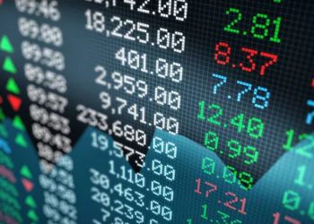 FILE PHOTO: A price screen display above the floor of the New York Stock Exchange (NYSE) after the close of trading in New York, U.S., March 12, 2020. REUTERS/Brendan McDermid/File Photo